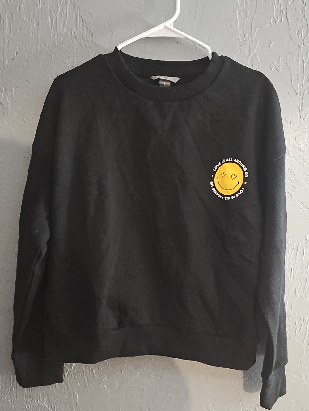 Trac Black Crewneck Sweater with Yellow Smiley Patch
